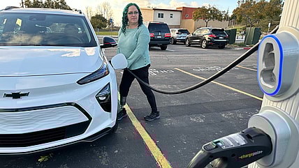 You Can Save Money With EVs, Right? Here’s How Much, and How to Find Deals On the Best EVs 2 Charging A Chevy Bolt Ev At A Pubic Charger