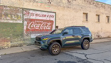 The Toyota 4Runner Trailhunter Parked In Front Of A Faded Mural