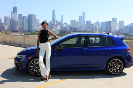 Corliss Standing Next To The 2025 Vw Golf R 2.0T