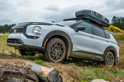 5 Reasons We're Stoked About the 2025 Mitsubishi Outlander Trail Edition 1 The 2025 Mitsubishi Outlander Trail Edition Climbing A Muddy Hill