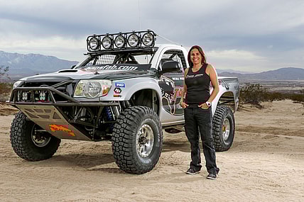 Nicole Pitell-Vaughn Standing Next To A Truck That Her Company, Total Chaos Fabrication, Helped Build