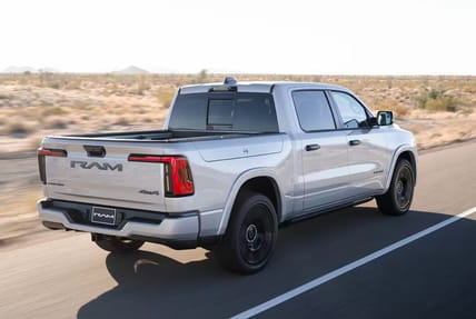 A 2025 Ram 1500 Ramcharger Driving Down A Highway