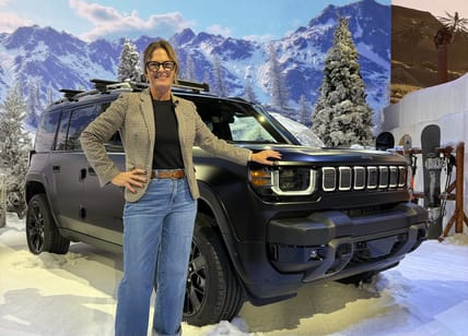 Sara Lacey Standing With The New Jeep Recon Ev Suv