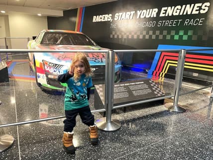 My Son Standing In Front Of A Nascar Race Car