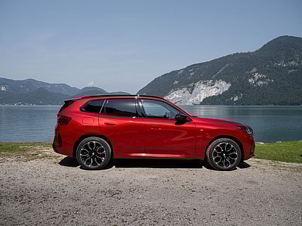 The All New 2025 Bmw X3 M50 Parked Near A Scenic Lake