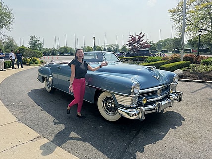 Connie Peters Standing Next To A New Yorker During The Chrysler 100 Celebration