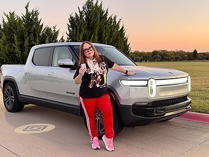 Natalie Merola Standing With The 2026 Rivian R1T Quad Motor