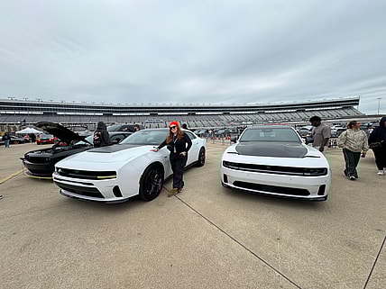 Natalie Standing With A Few Dodge Charger Sixpacks During Mopar Heaven