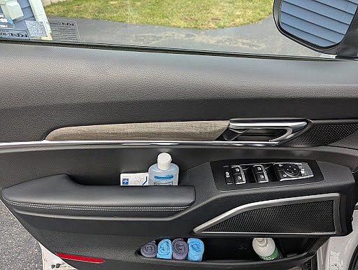 I'm a Traveling Nurse. This is How I Organize My 2022 Kia Telluride For Work and Family 5 A Bottle Of Hand Sanitizer In The Driver'S Side Door Of My 2022 Kia Telluride