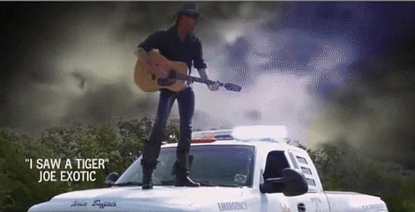 Tiger King Joe Exotic Standing On The Hood And Singing