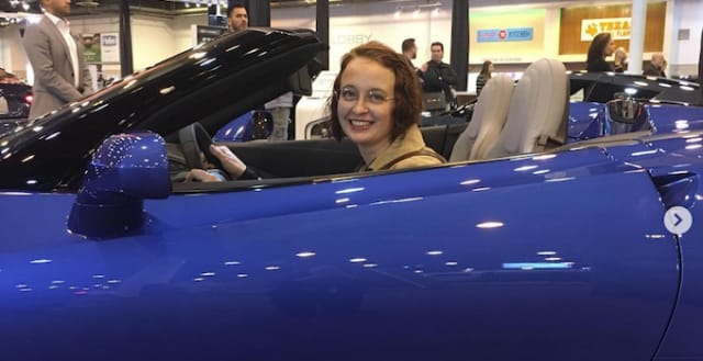 Erica tries out a convertible at the Houston Auto Show and yes, it looks good on her! Photo: Erica Mueller