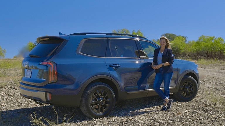 Buy This Not That: The Best SUVs For Winter Driving—and What They Cost New and Used 12 Me With The 2023 Kia Telluride X-Pro In Midnight Lake Blue