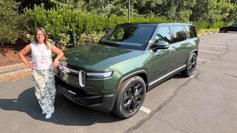Buy This Not That: Best Luxury SUVs—and the Worst—For Families Who Need 7 Seats 5 Sara Lacey Standing Next To The Rivian R1S