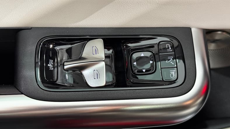 The Dual Window Control Buttons Toggle To Control Front Or Rear Windows