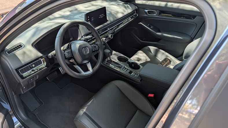 The Interior Of The 2026 Honda Civic Hatchback Sport Touring Hybrid