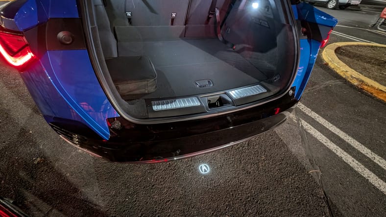 The trunk and Acura symbol illuminated on the ground from the ZDX Type S