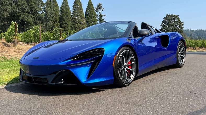 When 25 Women Test Drive Dream Cars, What Do They Choose? You Might Be Surprised. 7 The 2025 Mclaren Artura Spider Hybrid Parked Near A Winery