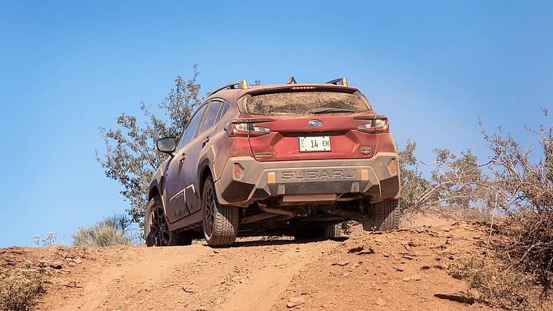 The 2024 Subaru Crosstrek Wilderness Climbing A Dusty Hill