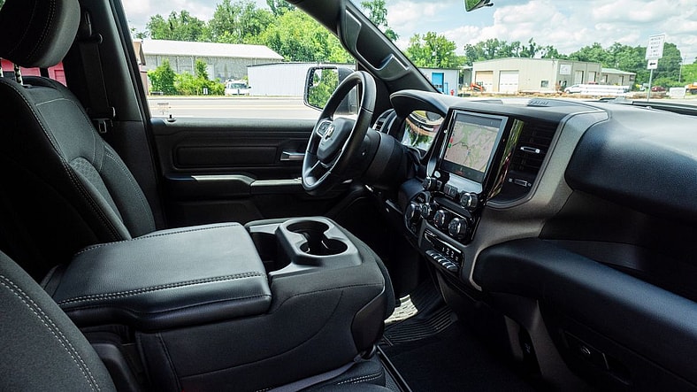 The 2025 Ram 1500 Warlock: Where Muscle Meets Magic (For Most) 5 The Interior Of The 2025 Ram 1500 Warlock Facing The Driver'S Door From The Passenger'S Side