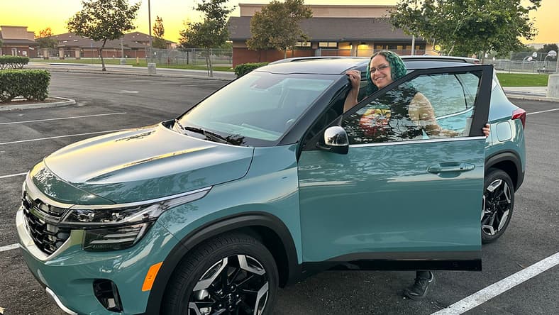 Featured Image - Liv Leigh Smiles While Hopping Into The 2024 Kia Seltos Sx Turbo Safest Cars On The Road Upside Down Car Loan Best Suv Under $30,000
