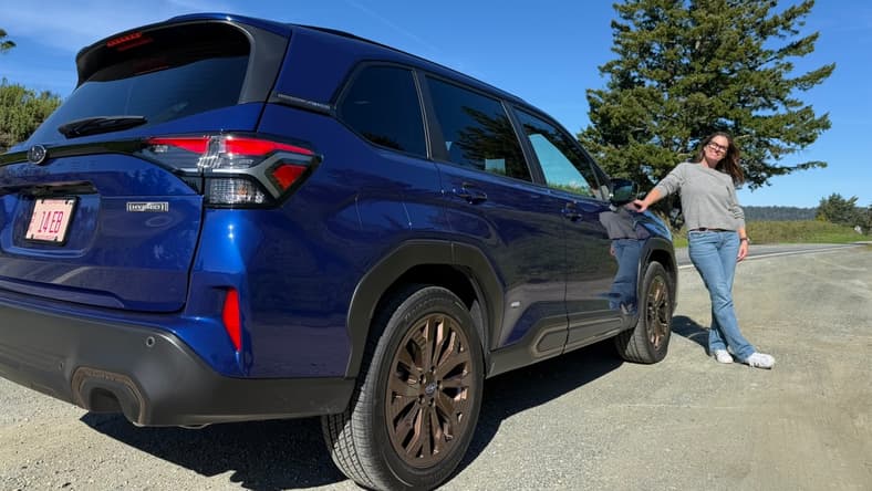 Sara Lacey Standing Next To The Subaru Forester Hybrid