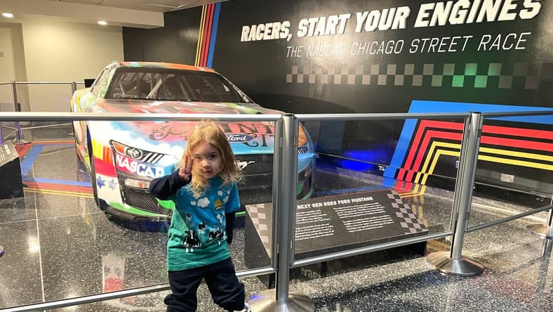 From the Mouths of Babes: 6 Things My Nephew and Niece Love About NASCAR… and Now I Do, Too 1 My Son Standing In Front Of A Nascar Race Car