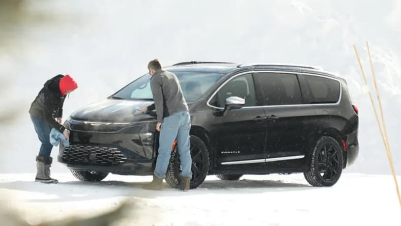 Two People Cleaning The Exterior Of The 2026 Chrysler Pacifica