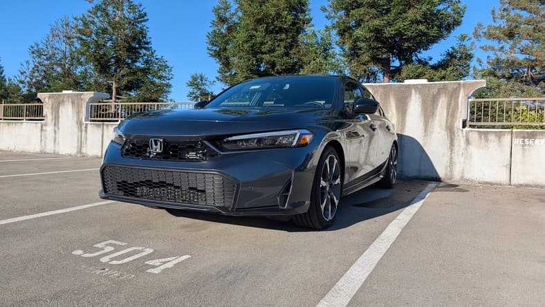 The Front Quarter End Of The 2026 Honda Civic Hatchback Sport Touring Hybrid