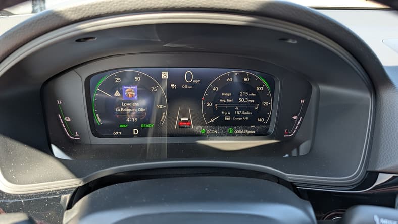 The Driver Display Of The 2026 Honda Civic Hatchback Sport Touring Hybrid Shows An Average Of 50.3 Mpg