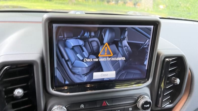Don't Let Heatstroke Threaten your Kids and Pets: Tips to Prevent This Tragedy 2 An Image Of The Rear Seat With A Child'S Car Seat Is An Emphatic Reminder To Check The Rear Seats When You Leave The Car