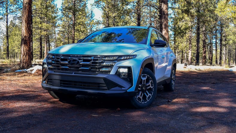 6 Things I Loved (And 2 I Didn't) In the Capable and Comfortable Hyundai Tucson XRT 2 The Front End Of The Hyundai Tucson Xrt On A Dirt, Wooded Road