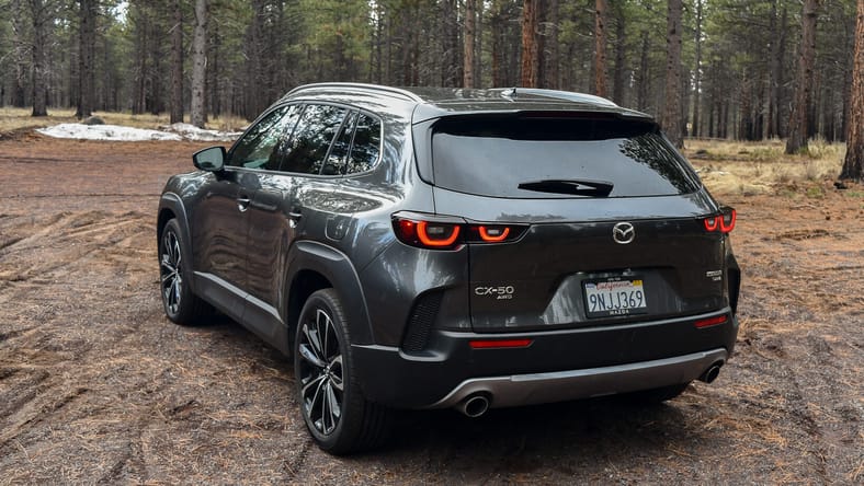 The Rear Driver'S Side Quarter Of The 2025 Mazda Cx-50 2.5 Turbo Premium Plus