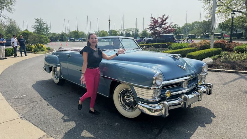 Connie Peters Standing Next To A New Yorker During The Chrysler 100 Celebration