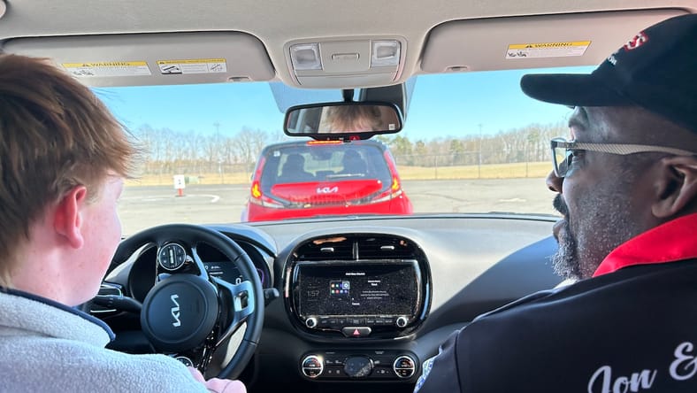 Student And Instructor In Kia Souls At B.r.a.k.e.s. Driving School