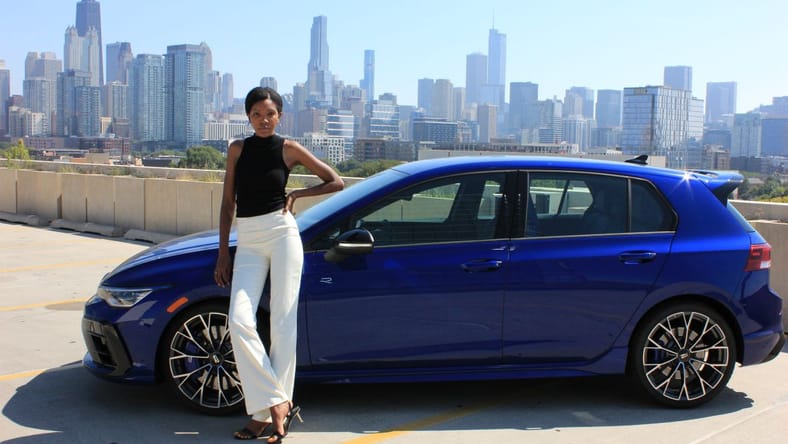 Corliss Standing Next To The 2025 Vw Golf R 2.0T