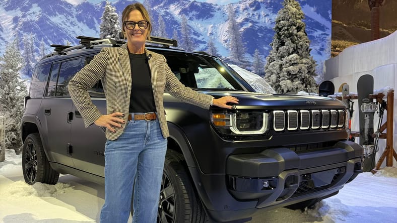 Sara Lacey Standing With The New Jeep Recon Ev Suv
