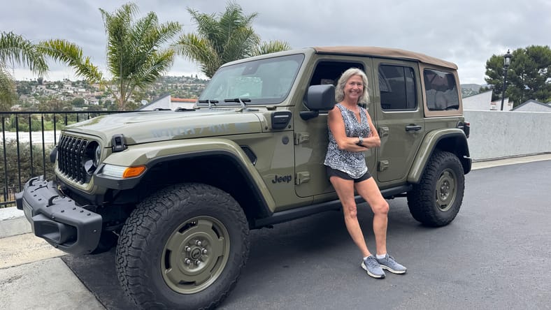 Kymri Wilt Standing With The 2025 Jeep Wrangler 4Xe Willys