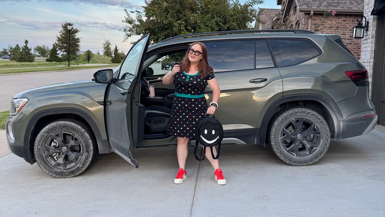 Natalie Merola Standing With The Vw Atlas Peak Edition