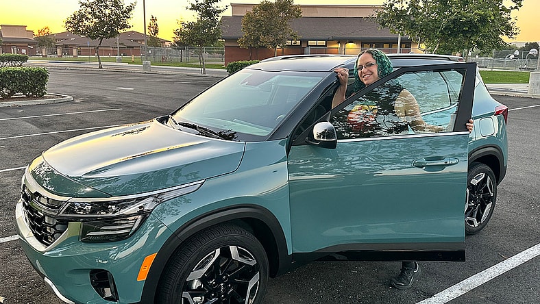 Featured Image - Liv Leigh Smiles While Hopping Into The 2024 Kia Seltos Sx Turbo Safest Cars On The Road Upside Down Car Loan Best Suv Under $30,000