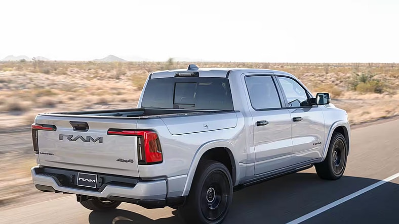 A 2025 Ram 1500 Ramcharger Driving Down A Highway