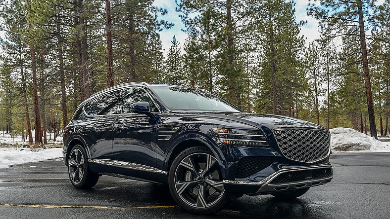 The 2024 Genesis Gv80 In A Wooded Parking Lot