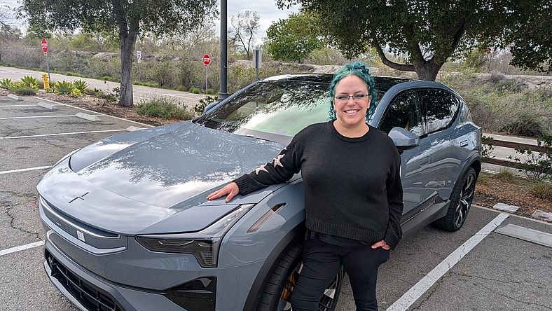 EV Innovation Meets Inclusivity: How the 2025 Polestar 3 Caters to All Drivers 2 Liv Leigh Standing Next To A Polestar 3