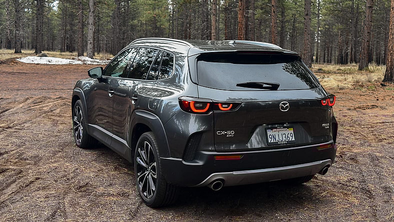 The Rear Driver'S Side Quarter Of The 2025 Mazda Cx-50 2.5 Turbo Premium Plus