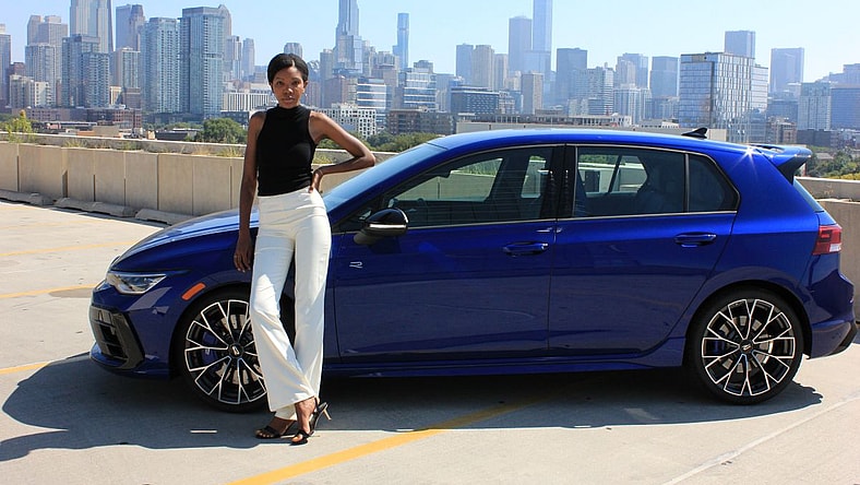Corliss Standing Next To The 2025 Vw Golf R 2.0T