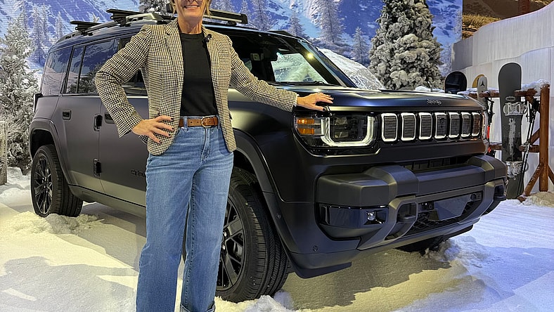Sara Lacey Standing With The New Jeep Recon Ev Suv