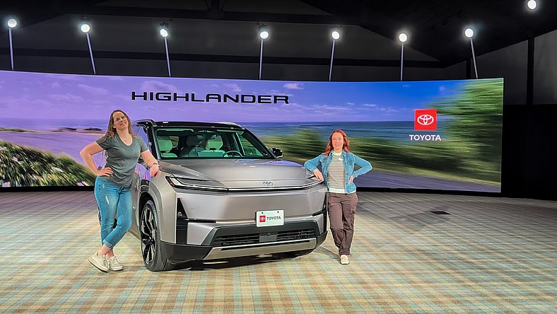 Shannon Bassett And Kristen Brown Standing Next To The 2027 Toyota Highlander Ev