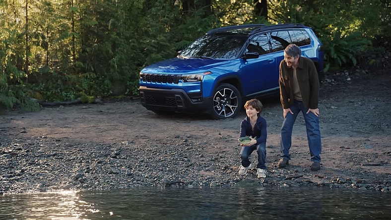 The Jeep Cherokee Hybrid Commercial For The 2026 Super Bowl, Featuring A Father And Son Releasing A Billy Bass Toy Into A Nearby River