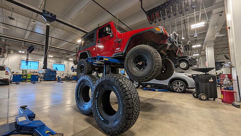 I Buy My Tires Exclusively From Costco, and Have for Years. Here's Why I Recommend it 2 Tires Being Installed On My Jeep