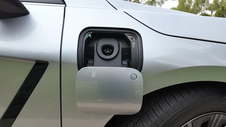 The Novel Power Door On The 2026 Lexus Es Lowers Down And Out Of The Way, Revealing A Nacs Port