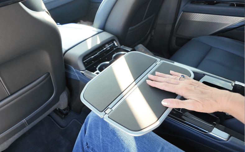 The Executive Package In The Cadillac Escalade Iq Even Has Tray Tables In The Center Arm Rest!